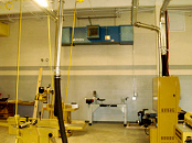 Air cleaner filters wood dust in workshop.